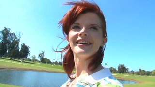 Golfing redhead milf in action